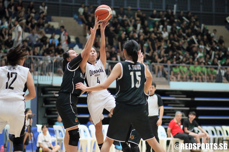 Teh Wen Jan (DHS #4) takes a tough fading shot over the defense. She swished seven three-pointers en route to a game-high 21 points. (Photo  © Chan Hua Zheng/Red Sports)