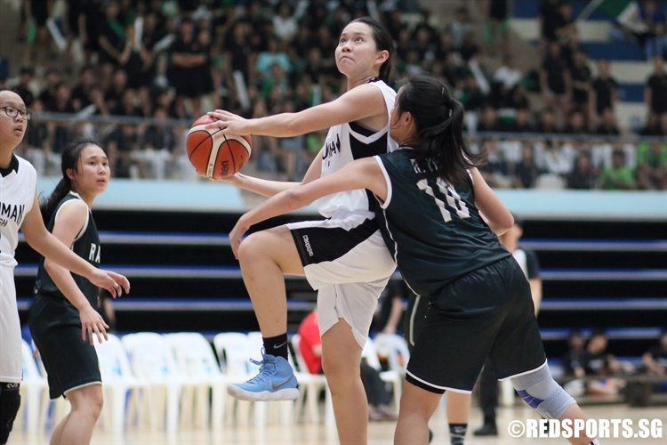 Tabitha Tay (DHS #11) goes for a lay-up against the defense. (Photo  © Chan Hua Zheng/Red Sports)