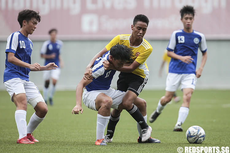 Hafiz Amir (#2) of Victoria Junior College and Fikri Amin (#17) of Meridian Junior College fights for possession of the ball. (Photo © Lee Jian Wei/Red Sports)