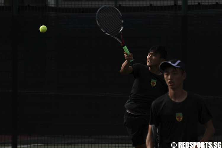 Park Jung Woo (L) and Amos Koh (R) of Raffles Institution in action against Shawn Ng and Oliver Loo of ACS (Independent). (Photo © Lee Jian Wei/Red Sports)