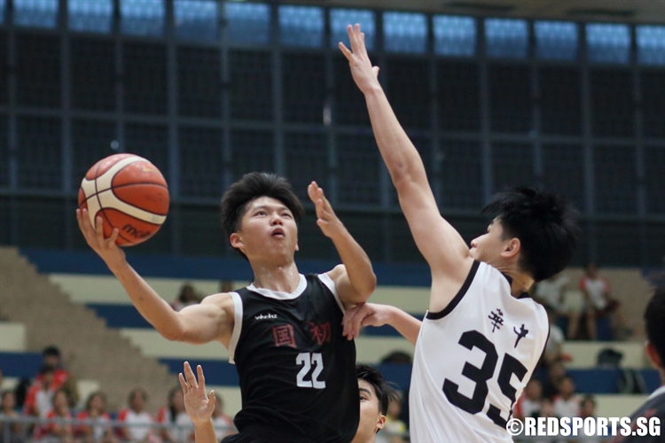 Huang Yifan (NJC #22) soars for a lay-up against HCI. The NJC forward scored 19 points to lead his school to their first ever final. (Photo 1 © Dylan Chua/Red Sports)