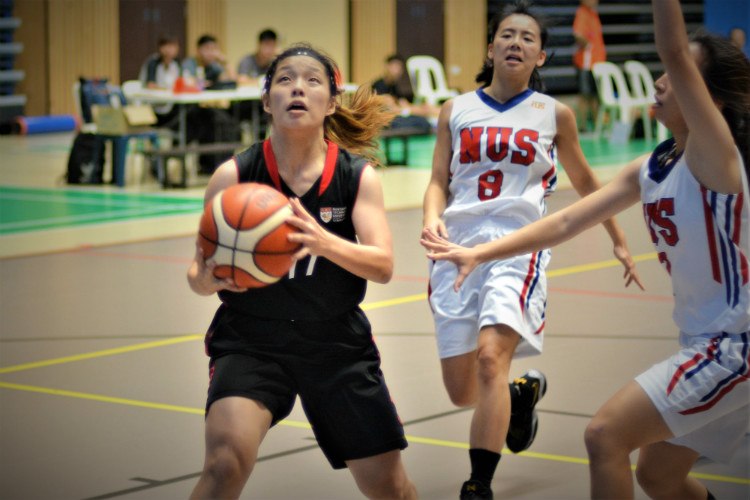 Nanyang Technological University (NTU) dominated proceedings in their Singapore University Games (SUniG) match against National University of Singapore (NUS) to defend their home court with a convincing 57-26 win. (Photo © Low Zheng Yu/Red Sports)