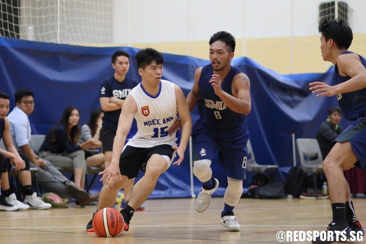 Lim Jun Jie (NP #15) drives baseline against his defender. (Photo  © Chan Hua Zheng/Red Sports)