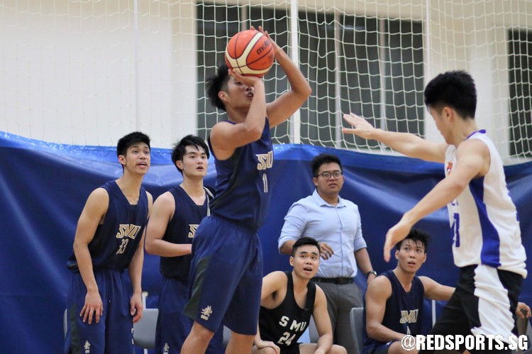 Shaun Lim (SMU #11) rises for a corner three. (Photo  © Chan Hua Zheng/Red Sports)