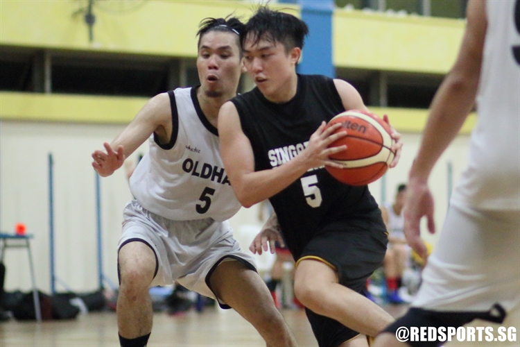 Yong An (SP #5) drives through the defense to the hoop. (Photo  © Chan Hua Zheng/Red Sports)