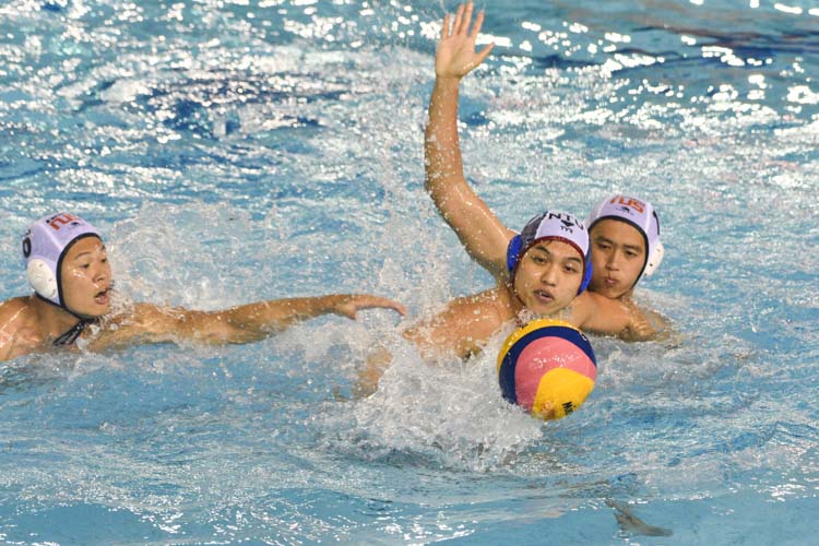 Daniel Toong (NTU #10) protecting the ball during the match as NUS' defenders surround him. (Photo 1 © Stefanus Ian/Red Sports)