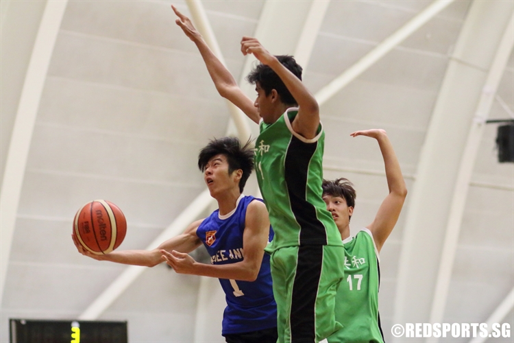 John Ang (NP #1) attempts a heavily contested lay-up. (Photo  © Chan Hua Zheng/Red Sports)