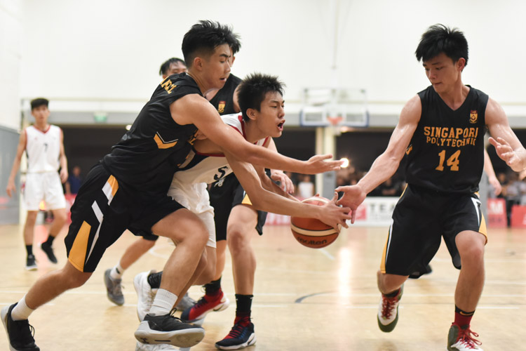 Nanyang Polytechnic's Wong Teng Yew (NYP #5) being fouled as he drives towards the basket. He would later convert one out of two free throws to put the game beyond the reach of Singapore Polytechnic. (Photo 1 © Stefanus Ian/Red Sports)