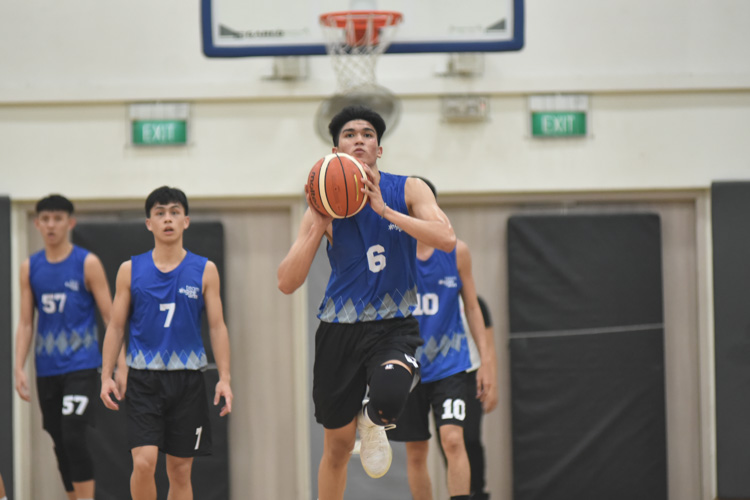 Saysay Erwin Pilli (NP #6) making a buzzer beater half-court shot to close out their third quarter during the match between Temasek Polytechnic  and Ngee Ann Polytechnic. (Photo 1 © Stefanus Ian/Red Sports)