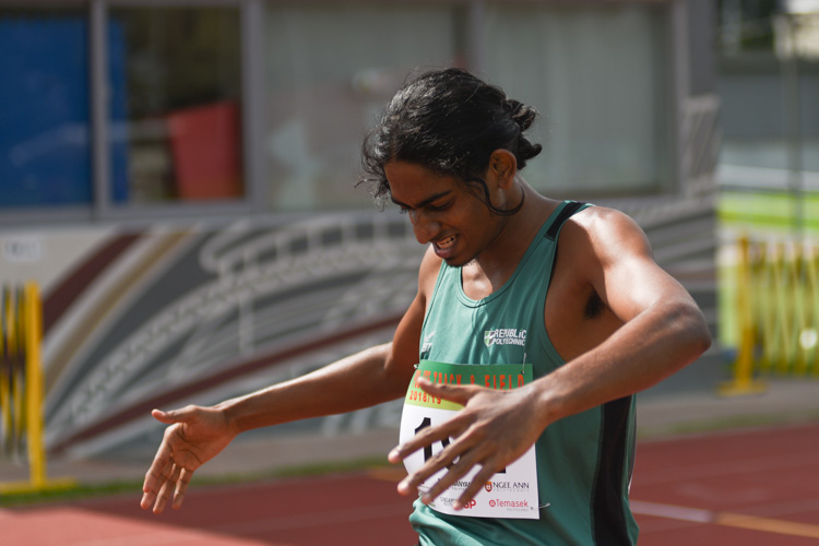 Kiranraj s/o Suresh beating his chest in celebration after he crosses the line during the Men's 1500 Metre Run Open race. (Photo 1 © Stefanus Ian/Red Sports)