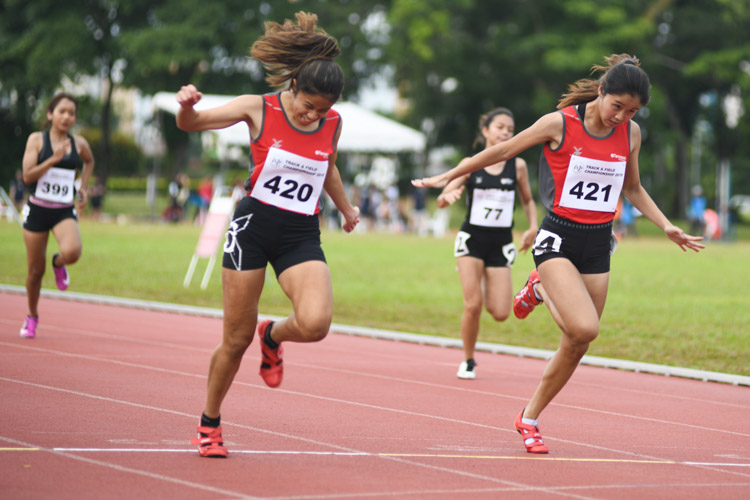Temasek Polytechnic clinched a 1-2 finish in the IVP 100m Women's event with Haanee bte Hamkah (#420) edging her teammate Clara Goh (#421) to win gold with a time of 12.66s.  (Photo 1 © Stefanus Ian/Red Sports)