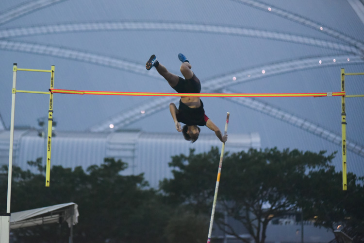 Joel Ho (#452) of Ngee Ann Polytechnic during a practice jump. He eventually won the IVP men's pole vault event with a height of 4.40m, beating NTU's Dewey Ng on countback. (Photo 1 © Iman Hashim/Red Sports)
