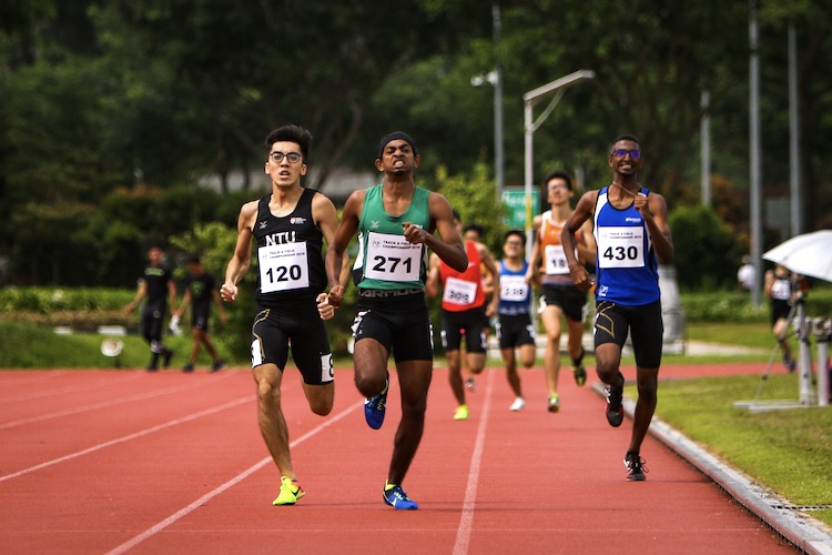 Jasper Tan (#120) of NTU, Kiran Raj s/o Suresh (#271) of Republic Polytechni and Jonathan Andrew (#430) of Temasek Polytechnic finishing the first timed Men's 800m final race. Kiran Raj of RP came in 2nd overall with a timing of 2:03.32. Jasper Tan followed in 3rd overall with a timing of 2:03.56, and Jonathan Andrew finished 4th overall with a timing of 2:04.58. (Photo 1 © REDintern Young Tan)