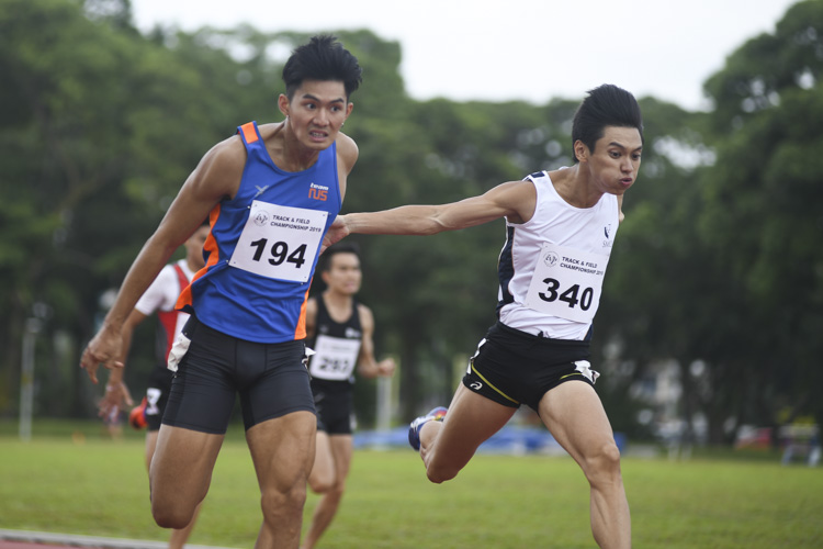 Timothee Yap of NUS (#194) and Tan Zong Yang of SMU (#340) dipping into the finish line. Timothee Yap of NUS won the Men's 200m race by 0.04s, stopping the clock at 21.65s as Tan Zong Yang of SMU came in second at 21.69s. (Photo 1 © Stefanus Ian/Red Sports)