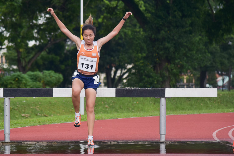 Isabella Cheong of NUS clinched silver in the Women's 3000m Steeplechase race with a time of 14:12.70. (Photo 1 © Iman Hashim/Red Sports)