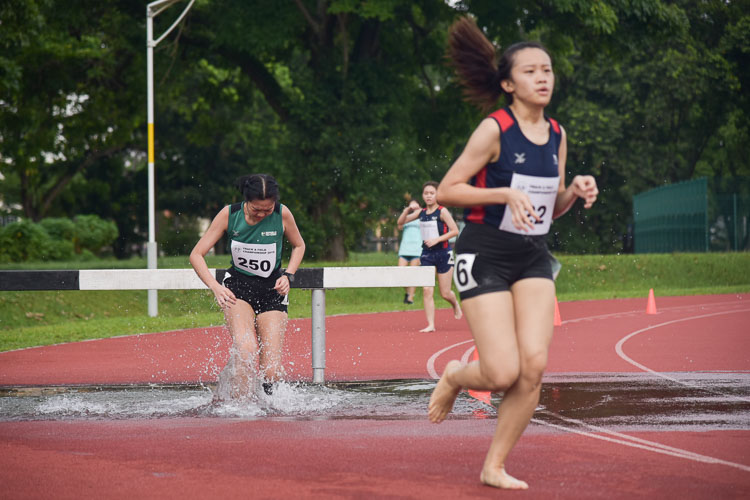 Liew Zhi Shan of RP going through the water jump during the Women's 3000m Steeplechase race she finished fifth with a time of 16:20.82. (Photo 1 © Iman Hashim/Red Sports)
