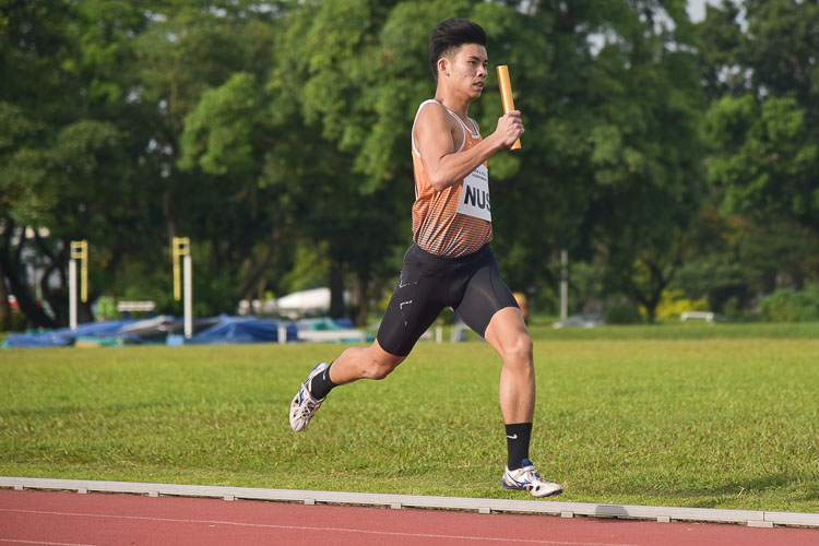 Russell Kam of NUS on the second leg in the first men's 4x400m relay timed final. (Photo 17 © Iman Hashim/Red Sports)