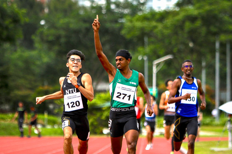 Kiran Raj s/o Suresh celebrating his chest after coming in first in his timed Men's 800m race. He would clinch silver with a time of 2:03.32 (Photo 1 © REDintern Young Tan)