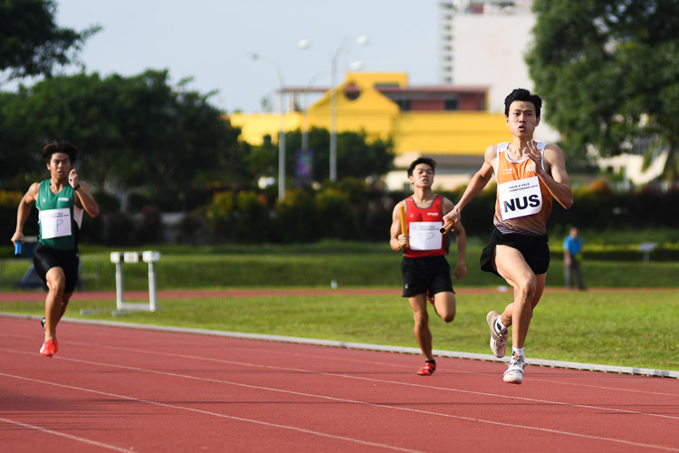 Triple jump champion Chan Zhe Ying giving NUS the lead in the first timed final of the men's 4x400m relay. (Photo 15 © Stefanus Ian/Red Sports)