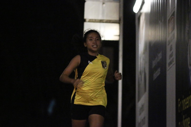 Stacia Ler running the fourth leg for Eusoff Hall in the women's race. She clocked a split of 7:18 to help Eusoff retain their women's road relay title. (Photo 5 © REDintern Young Tan)