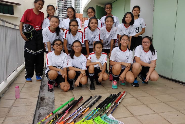 The Compassvale Girl's Floorball team posing for a team photo (Photo 1 by reader)