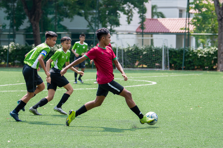 Mhd Ilhan Mansiz (#13) of SGS dribbles the ball as  Orchird Park players (left to right): Elfiyan (#7) and Faqih (#10). (Photo 1 © Jared Khoo/REDintern)