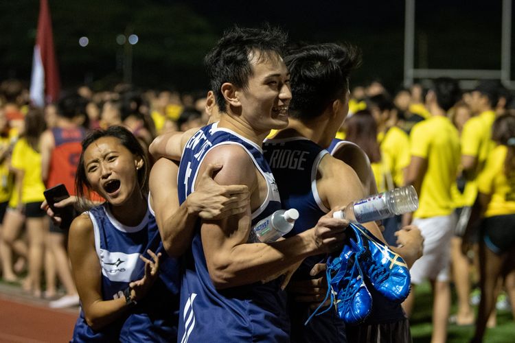 The Kent Ridge Hall team celebrates after the mixed medley. Their win in that event helped them pip Eusoff Hall by one point to clinch the Men's IHG Track title for the third straight year. (Photo 1 © REDintern Jared Khoo)