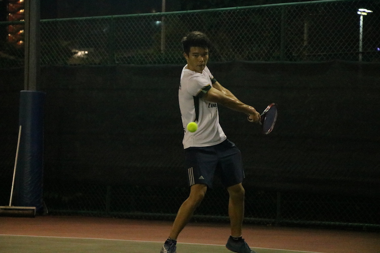 Marcus Teoh of Temasek Hall in action against Eusoff Hall during the Men's Singles match of the NUS IHG. (Photo 1 by REDIntern Julianna Jothi)