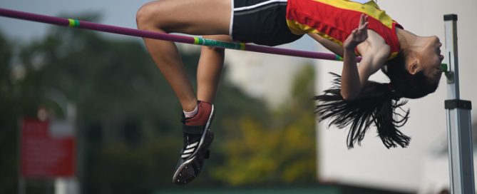 Tham Mei Shuen of HCI clinched gold in the A division girls high jump event with a final height of 1.54m. All the top three jumpers had the same final height of 1.54m and the officials had to do a countback to decide the winners. (Photo 1 © Stefanus Ian/Red Sports)
