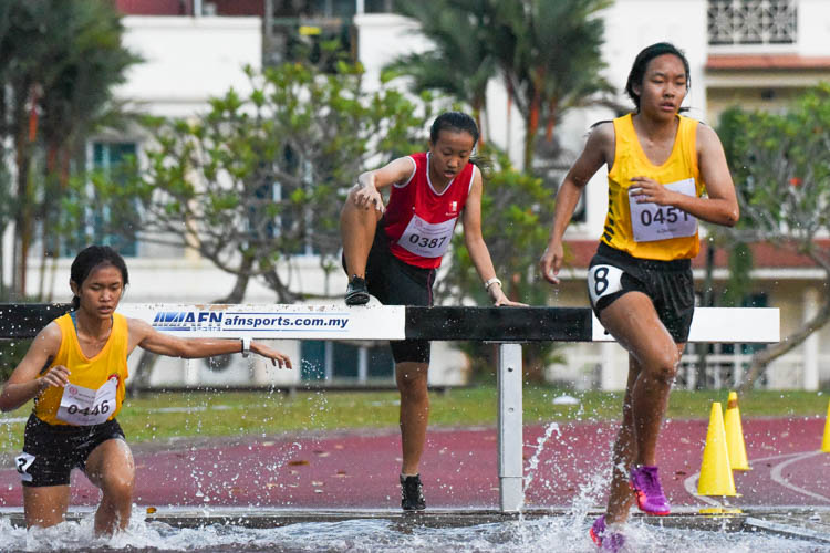 Shirley Tan (#387) of NJC goes through her water jump on the second last lap. She finished in ninth place. (Photo 17 © Iman Hashim/Red Sports)