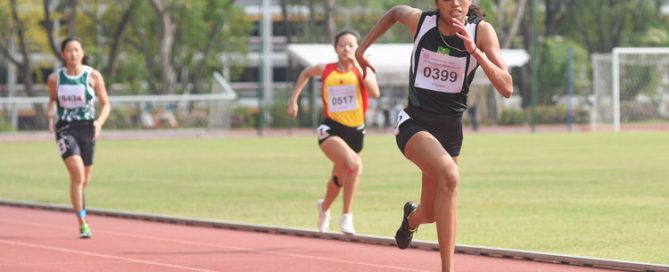 Grace Shani Anthony (#399) of RI clinched the A Division girls' 200m gold in 26.09s, just a few hundredths of a second shy off her personal best of 26.00s achieved in the B Division final two years ago. (Photo 2 © Iman Hashim/Red Sports)