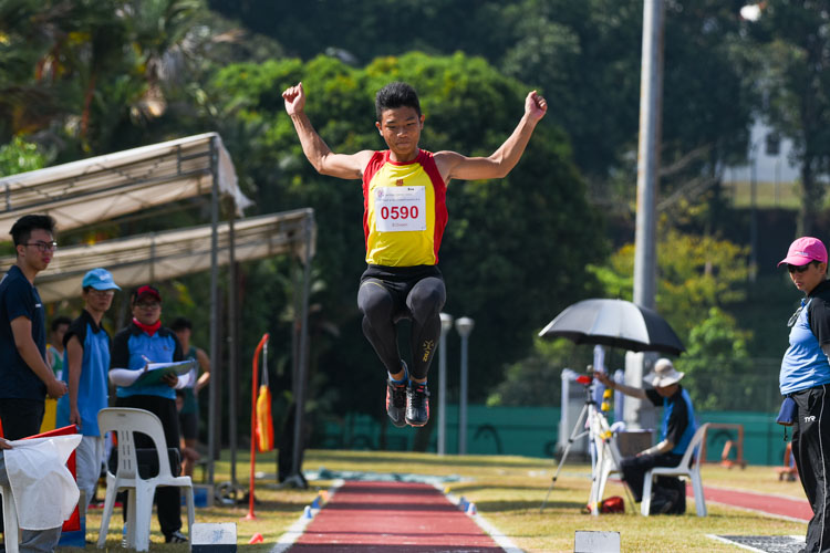 Zeen Chia (#590) of Hwa Chong Institution clinched his first ever National Schools gold with a winning leap of 6.69m in the B Division boys' long jump. (Photo 2 © Iman Hashim/Red Sports)