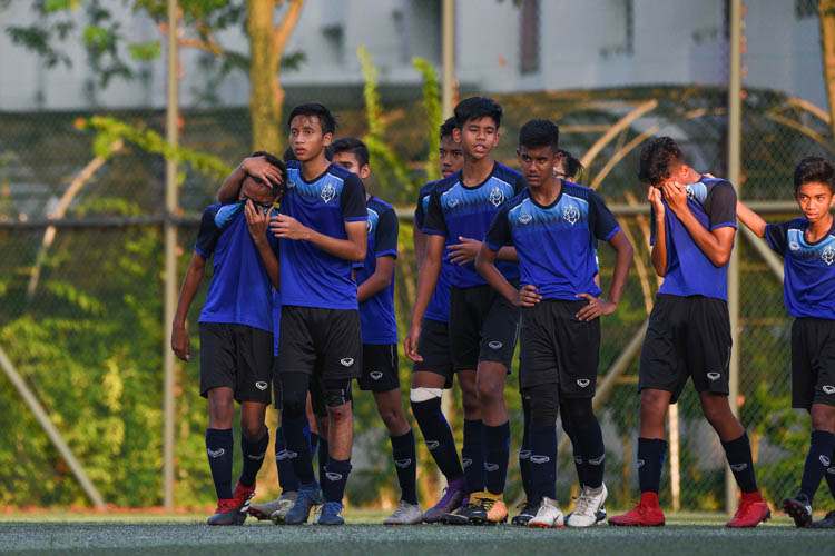 Teammates consoling Amirul Zulfaqar B Zuhaidi (NV #6, far left) after his penalty was saved in the shootout, handing Bartley the win. (Photo 1 © Iman Hashim/Red Sports)