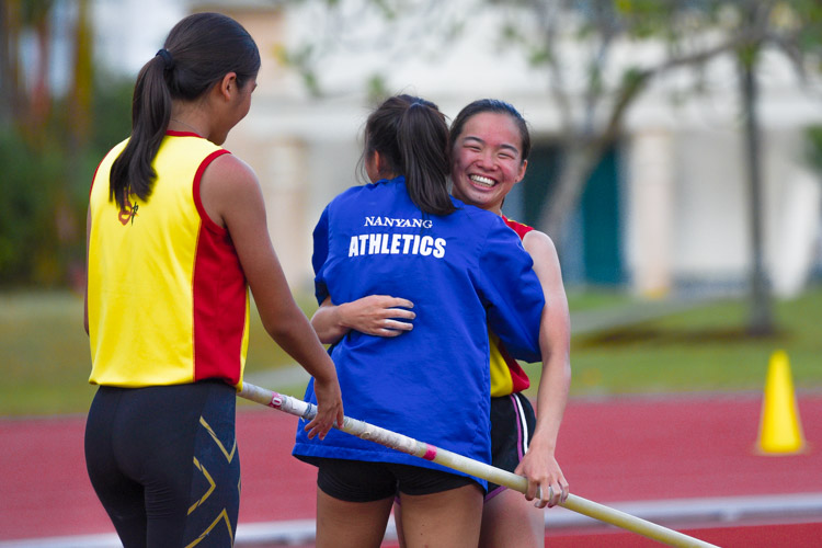 Silver medalist Christy Chng (in blue) of Nanyang Girls' High embracing training mate and competitor Mei Togawa of HCI after the competition. (Photo 5 © Iman Hashim/Red Sports)