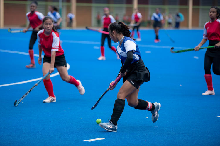 Teck Whye Secondary captain Myra Tan Shi Min (#33, in blue), shown here in blue, scored the fourth and final goal of the match.
