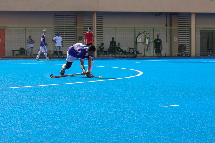 Muhammed Nasrullah B (SKS #2) swings his stick back as he garners power to pass the ball to a teammate up front. (Photo 9 © REDintern Jordan Lim)