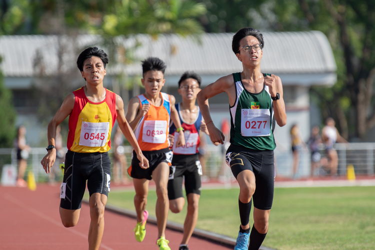 3000m B Division Boys' Finals: Chai Jiacheng (in green) summoning one last burst of speed to cross the finish line ahead of Hwa Chong Institution runner-up Chew Yue Bin (in yellow and red), Yuan Ching Secondary School runner Loh Wei Long (in orange), and Lim Wei feng (in red and blue) of Nan Hua High School.