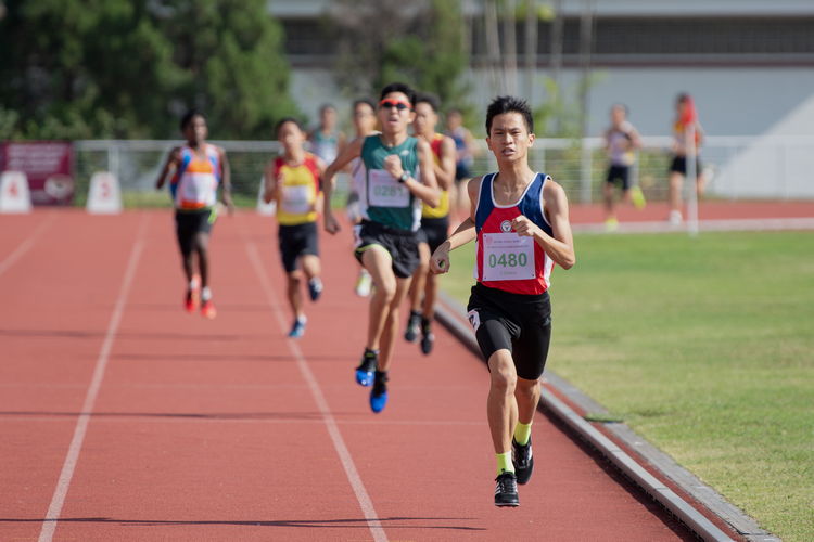 Mervyn Ong Shao Xuan of NHHS (in red and blue) placed first in the 1500m C Division Boys' Finals.
