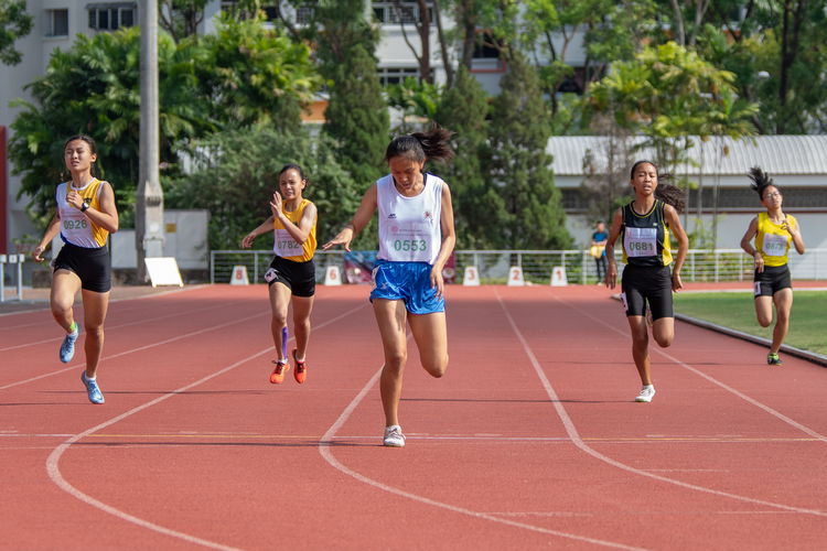 Laura Wong Si Teng of SNG (in white) won the 400m C Division Girls' Finals with a time of 01:03.36. Other runners (left to right): Ho Zhi Ling of NYGH, Soh Xuanya Mathilda of CG, Kirsten May Leong of CGS, and Chu Jo Lin of TMS.