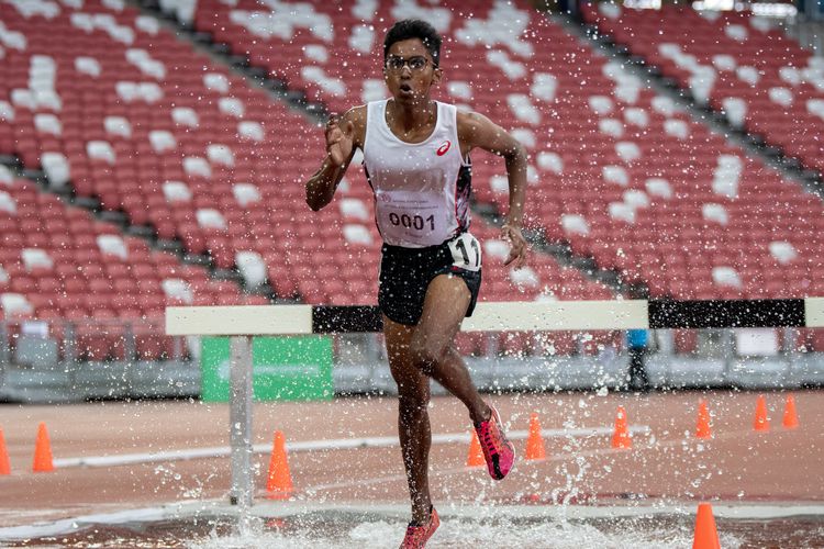Ruben S/O Loganathan (#1) of ASRJC finished first in the A Division Boys' 3000m steeplechase final with a time of 10:24.85.