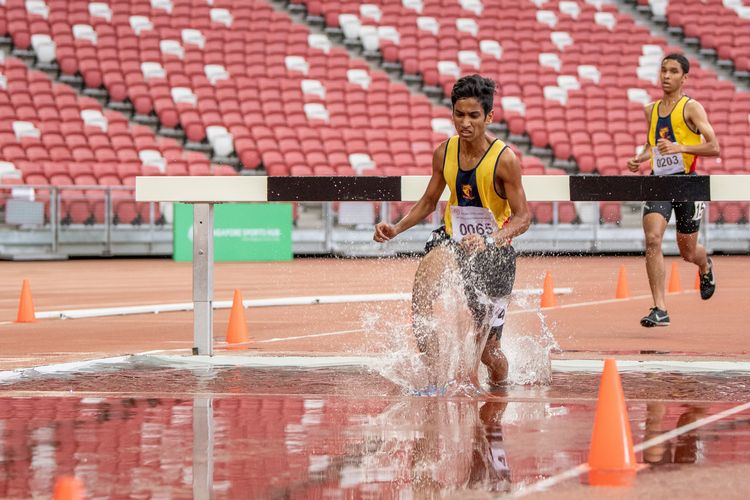 Rajesh Muthu (#65) of ACS(I) finished fourth in the A Division Boys' 3000m steeplechase final with a time of 10:51.71.