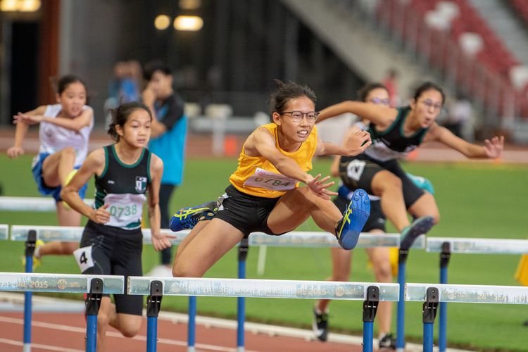 Ashley Tan (#784) of Cedar Girls' Secondary School finished in first place in the C Division Girls' 80m hurdles final with a time of 00:12.56.