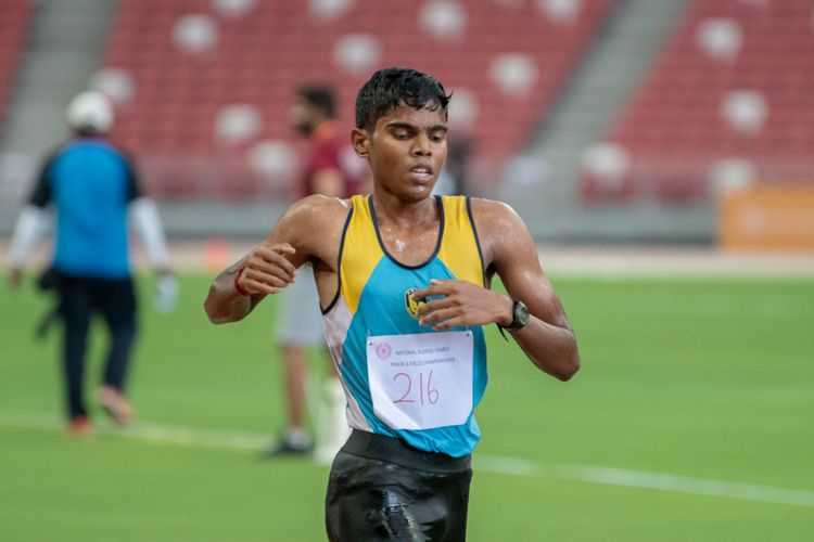 Kumar Saran (#216) of Bendemeer Secondary School finished in fifth place in the B Division Boys' 2000m steeplechase final with a time of 07:12.34.