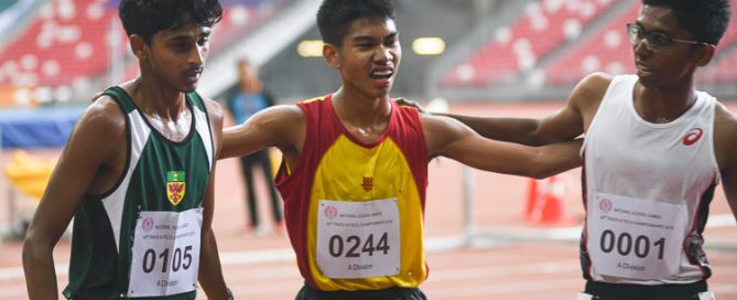 (Right to left) Ruben S/O Loganathan of Anderson Serangoon Junior College, Joshua Rajendran of Hwa Chong Institution and Armand Dhilawala Mohan of Raffles Institution coming together for a photo after the A Division Boys' 3000 metres steeplechase race. (Photo 1 © Stefanus Ian/Red Sports)