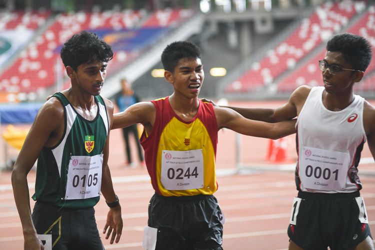 (Right to left) Ruben S/O Loganathan of Anderson Serangoon Junior College, Joshua Rajendran of Hwa Chong Institution and Armand Dhilawala Mohan of Raffles Institution coming together for a photo after the A Division Boys' 3000 metres steeplechase race. (Photo 1 © Stefanus Ian/Red Sports)