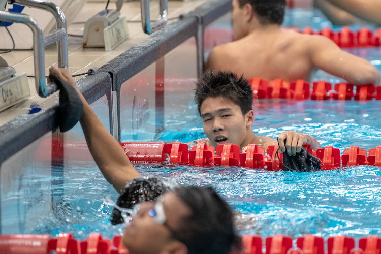 Jonathan Tan came first in the A Division boys' 100m freestyle final with a time of 50.64s, setting a new meet record.