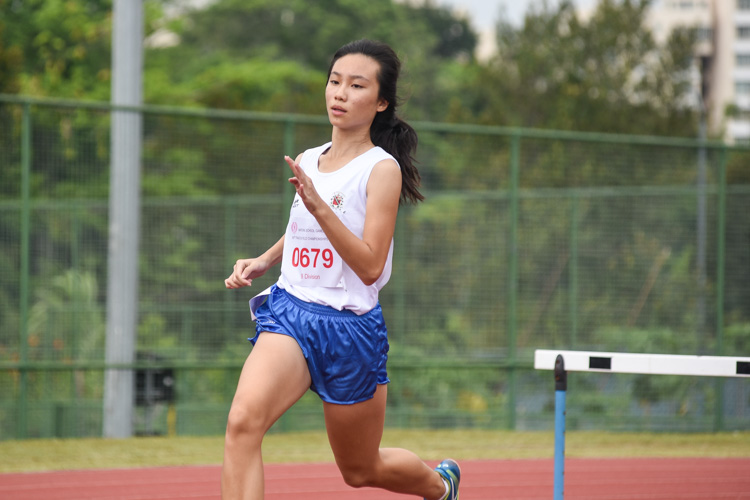 Tori Ng of CHIJ St. Nicholas Girls' School starts her run in the B Division girls' 400m hurdles final. She finished sixth in 1:14.96. (Photo 1 © Iman Hashim/Red Sports)