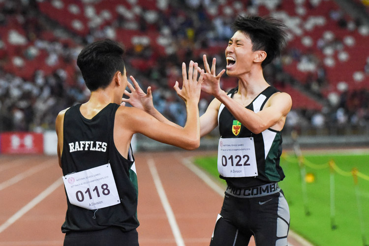 Marcus Tan (#122) celebrating with teammate Samuel Lee (#116) after the race, in disbelief that he has just clinched the A Division boys' 4x400m relay gold for RI. (Photo 1 © Iman Hashim/Red Sports)