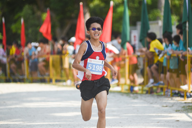 Nan Hua High's Nicholas Chew finished 19th in the Boys’ C Division cross country race with a time of 15:00.5. (Photo 1 © Iman Hashim/Red Sports)