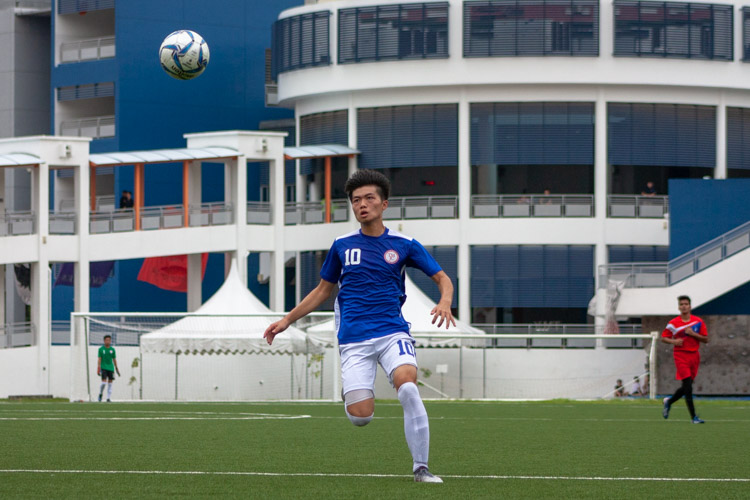 Victor Lim (TMJC #10) attempts to volley the ball. (Photo 6 © REDintern Jordan Lim)